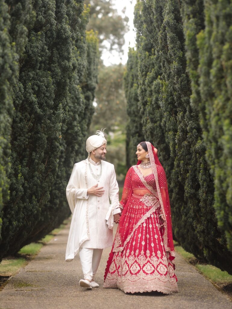 South Asian married couple walking in the countryside